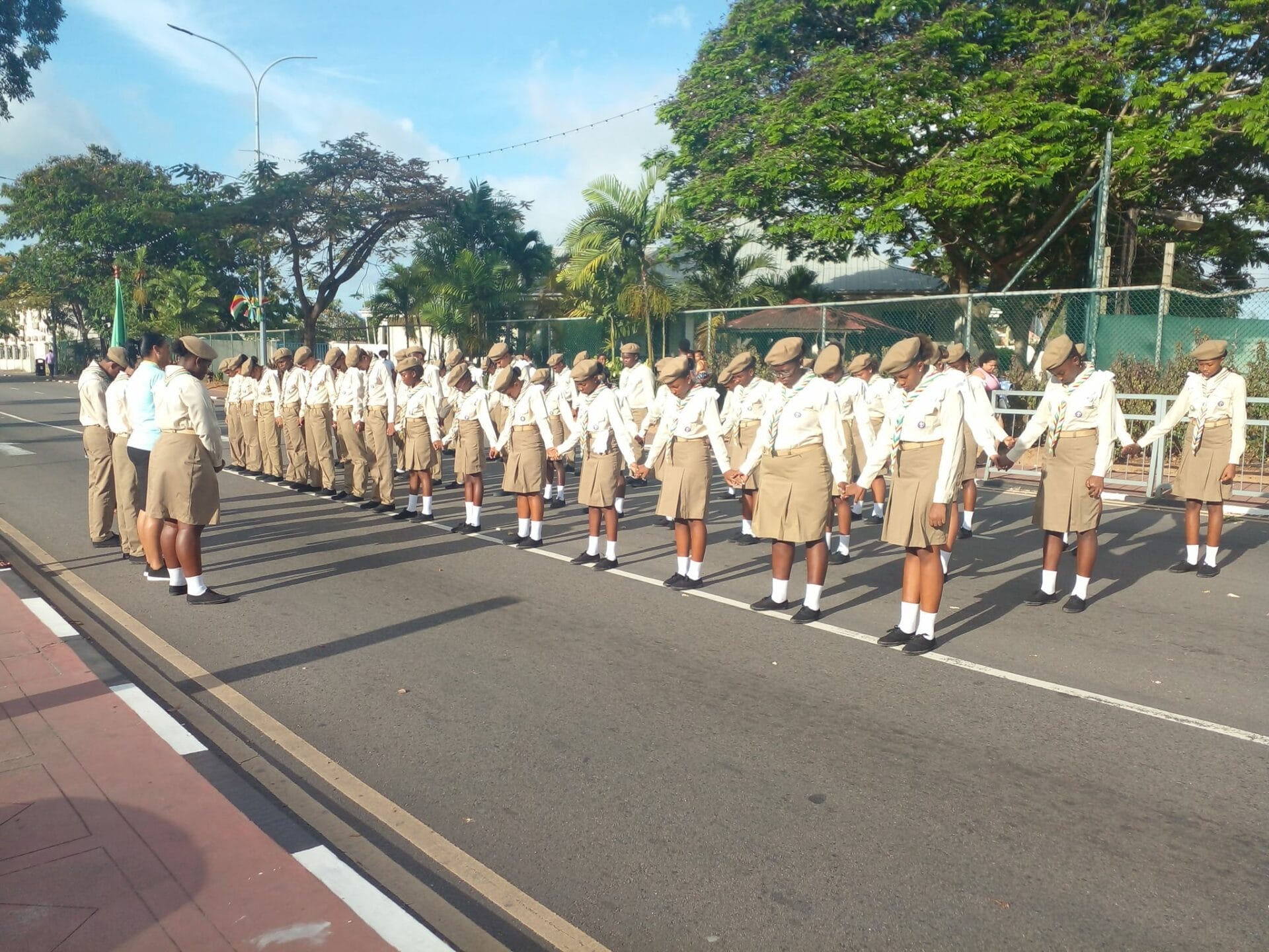 356233030_10232943758484761_4256758073825229932_n Seychelles Scouts in uniform lined up in formation during a parade, demonstrating discipline and unity as they represent the scouting tradition.