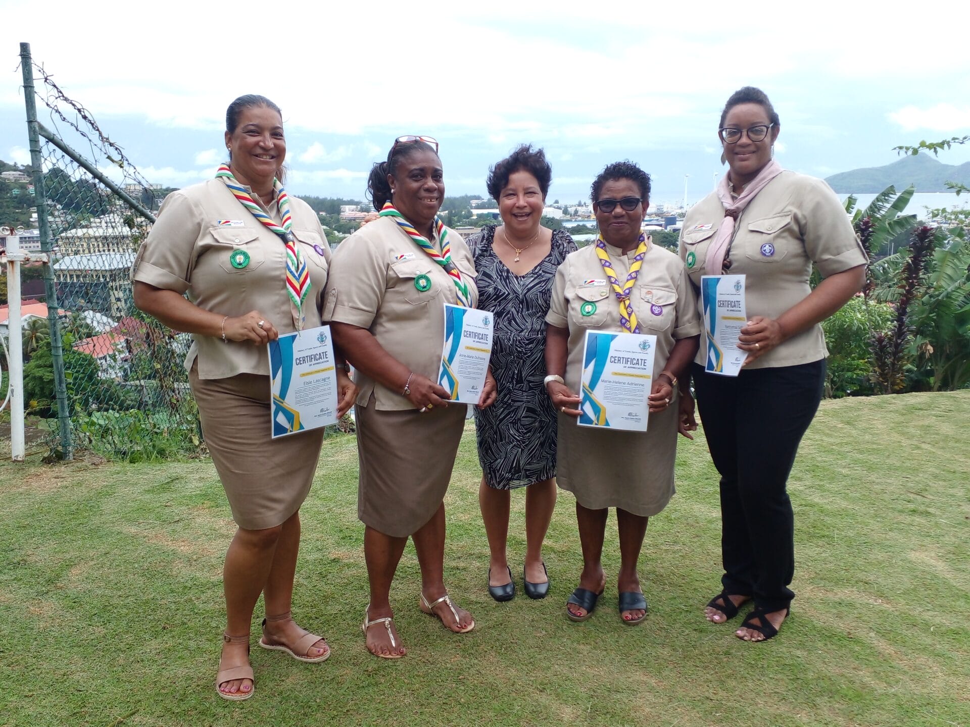 scout leaders posing with certificate of appreciation with minister zialor