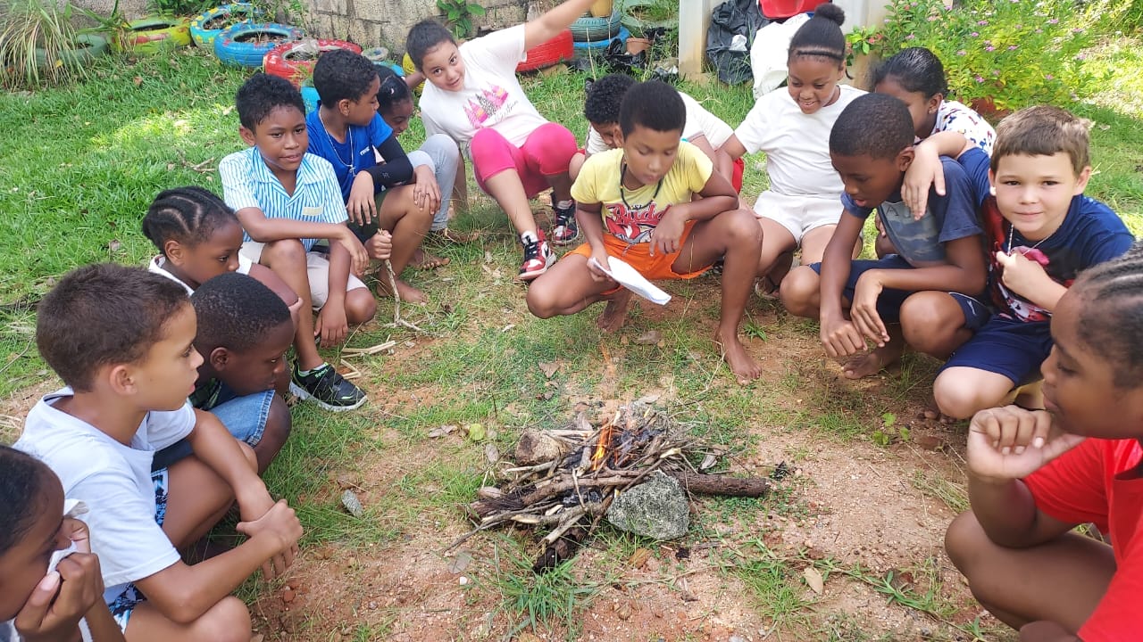 Bel Ombre primary school scouts baking and making campfire